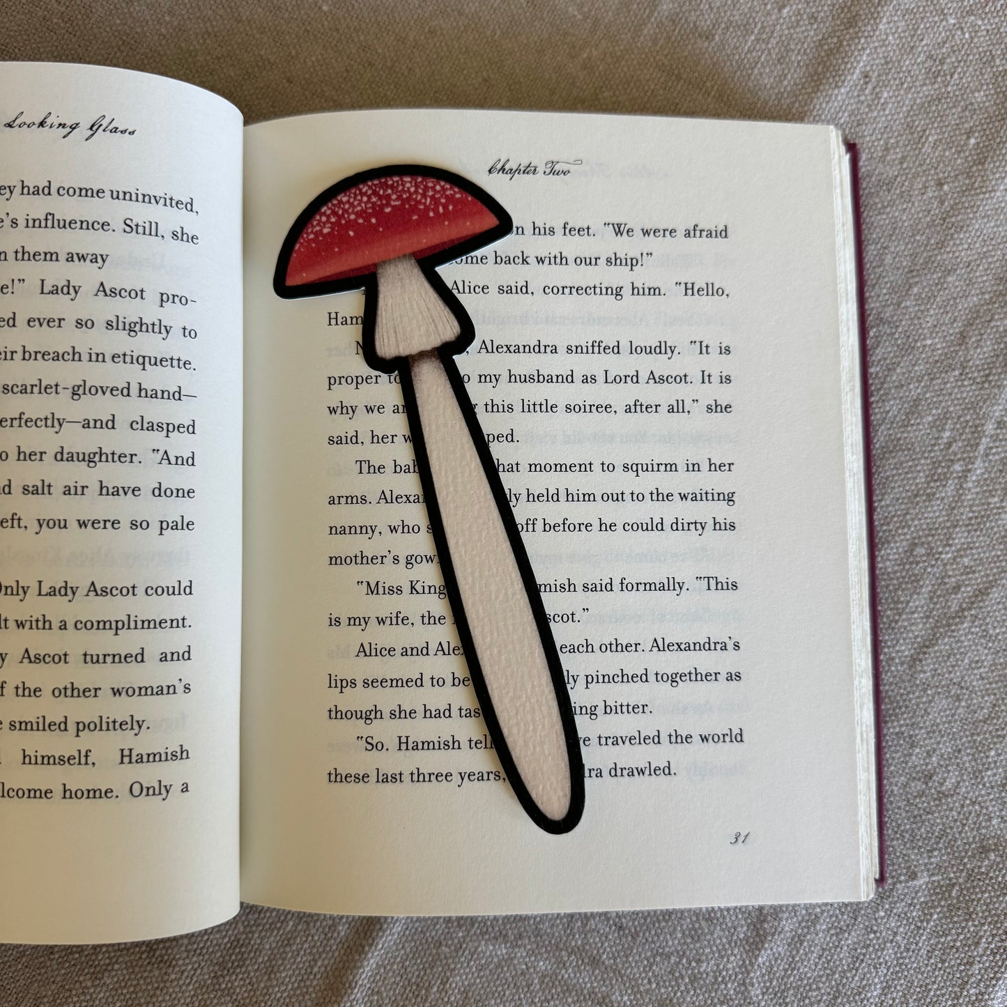 Mushroom-shaped bookmark on an open book